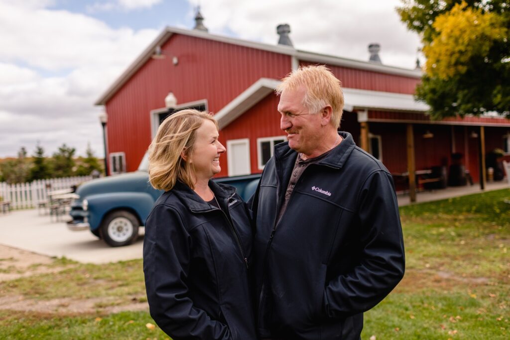 Wedding Venue Owners Marlys and Kurt, vintage blue truck, wedding venue in Minnesota, Minneapolis, wedding ranch, vintage wedding venue, Locally owned wedding venue, wedding venue education