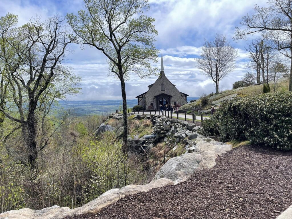 Cliffs at Glassy, Cliffs at Glassy Chapel, wedding venue Greenville, Greenville SC wedding venue, Greenville South Carolina wedding venue education, wedding venue education, wedding venue owner education, chapel on the cliffs overlooking views of trees and mountains. 