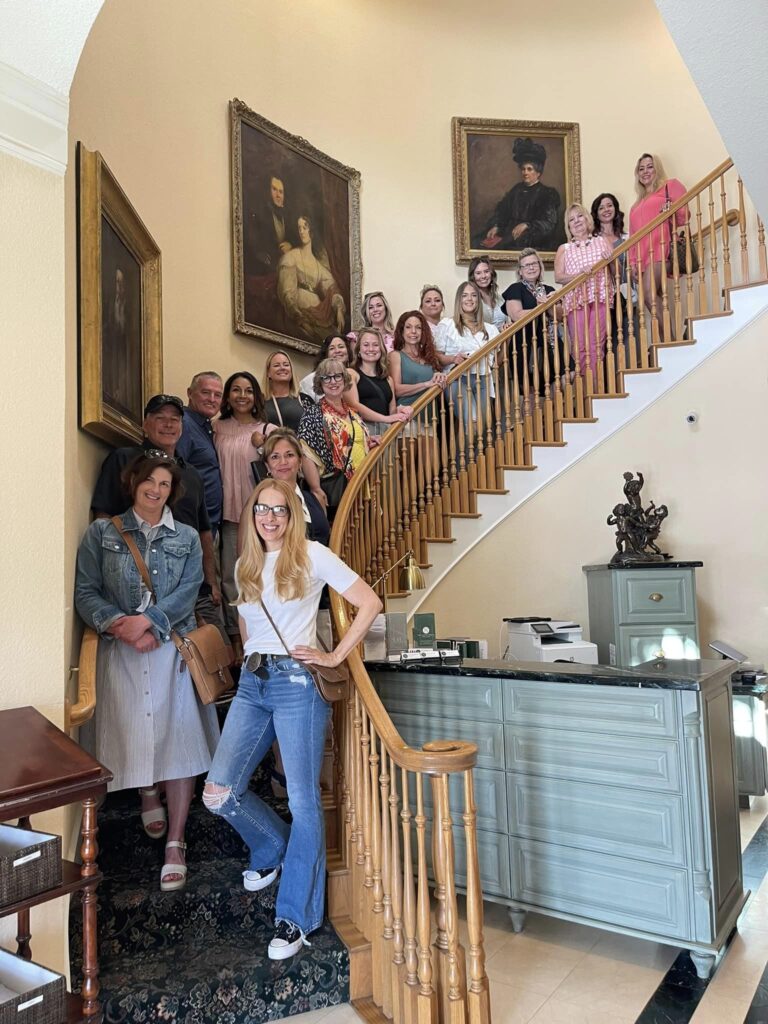 2025 SEO To-Do List for Wedding Venue Owners, wedding venue owners and managers on the stairs at a wedding venue education session in Dallas 