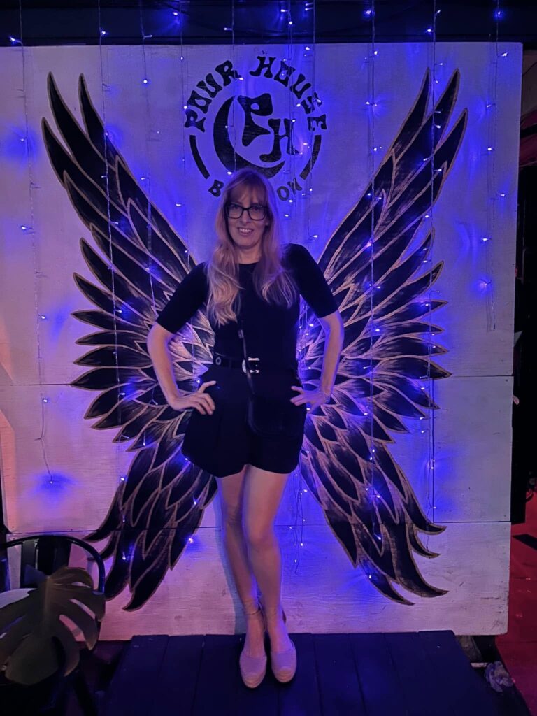 Didi Russell wedding venue expert, wedding venue consultant posing for a photo at a New Orleans French Quarter venue.