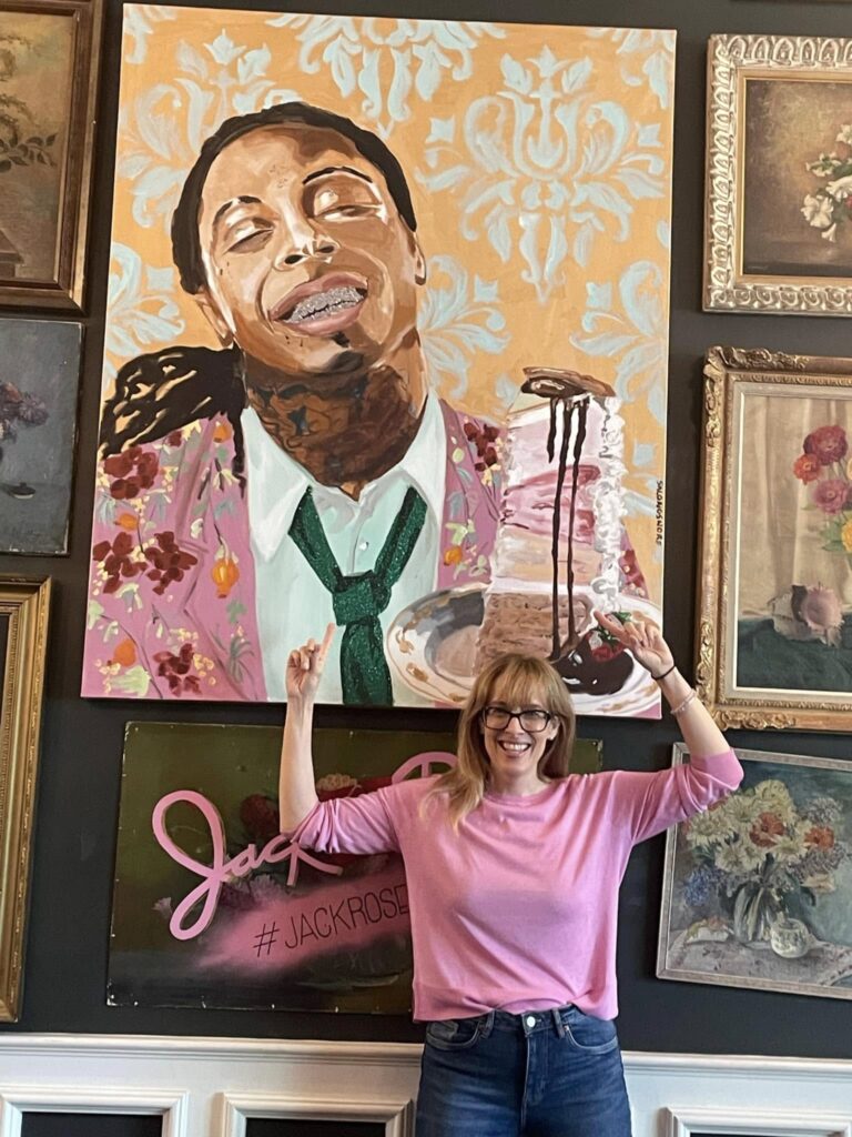 Best wedding venues in New Orleans, Hotel Pontchartrain, wedding venue, wedding reception, wedding ceremony, Didi Russell poses in front of a pic of Little Wayne