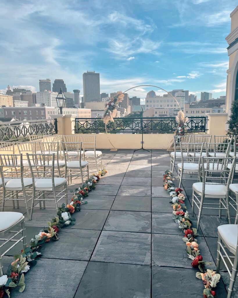 The 10 Best Wedding Venues in New Orleans, skyline view of New Orleans, outdoor wedding ceremony, wedding reception, wedding venue owner, locally owned wedding venue, wedding venue education, wedding venue consulting, wedding venue coach
