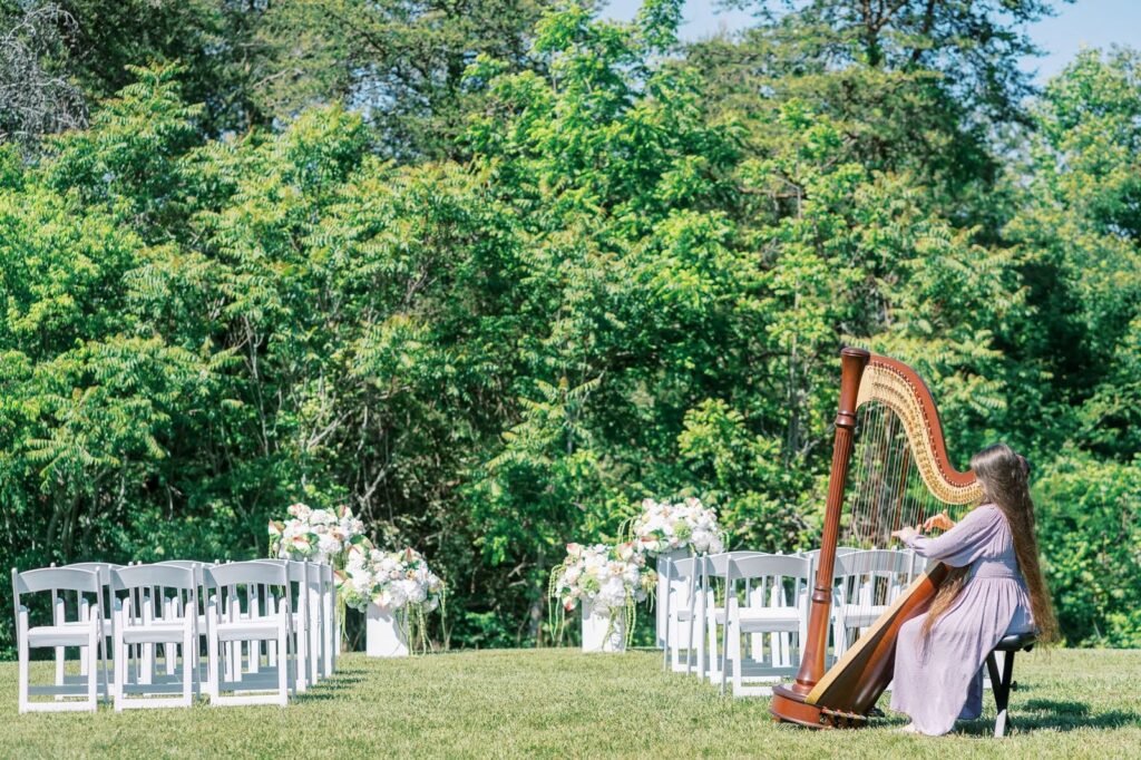 Outdoor wedding ceremony overlooking scenic countryside views at The Barn at Drewia Hill in Sale Creek Tennessee