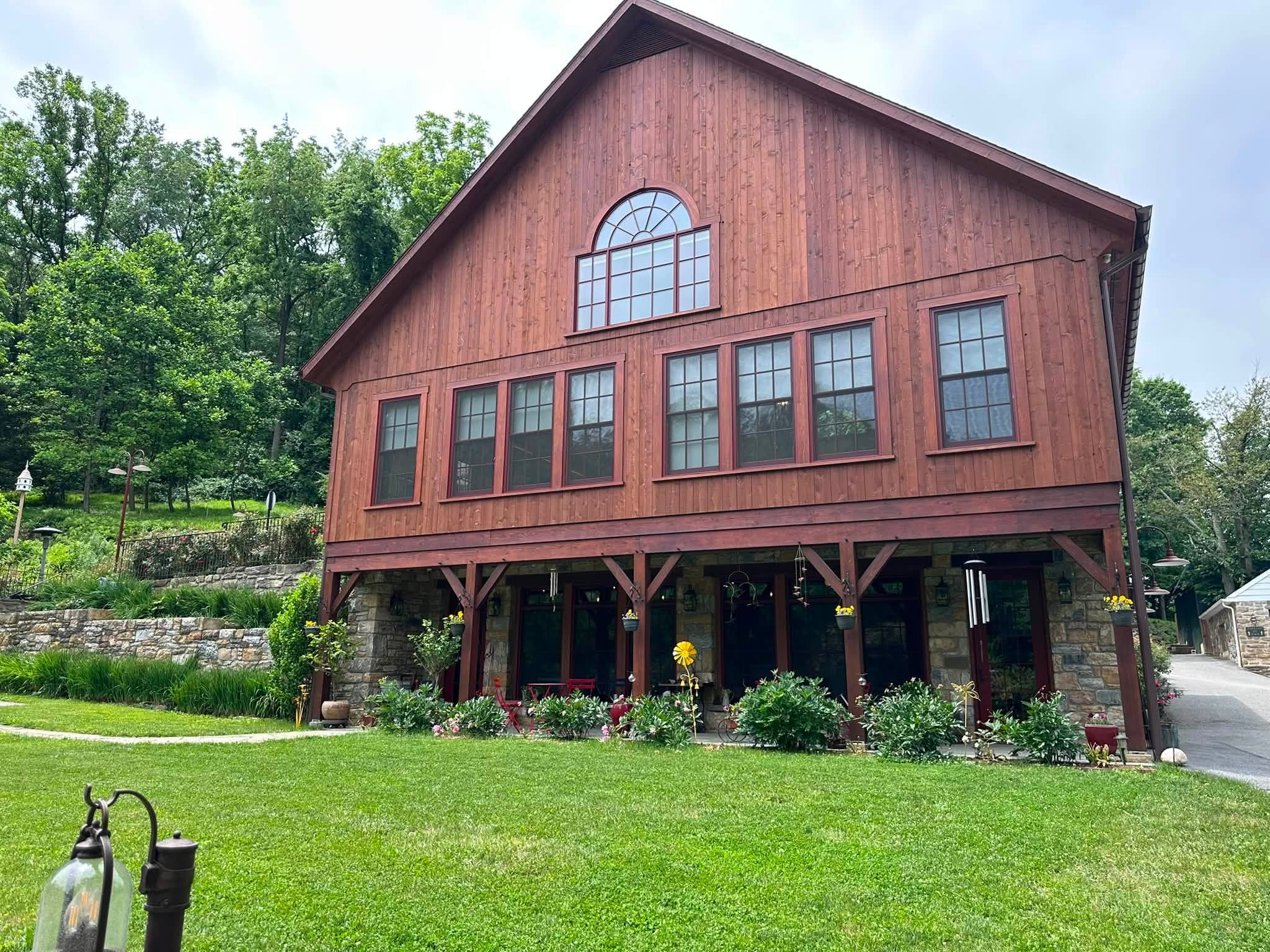 French Country Manor Estate is a historic bed breakfast with incredible gardens bridge over a river with a small waterfall feature and onsite lodging for wedding guests