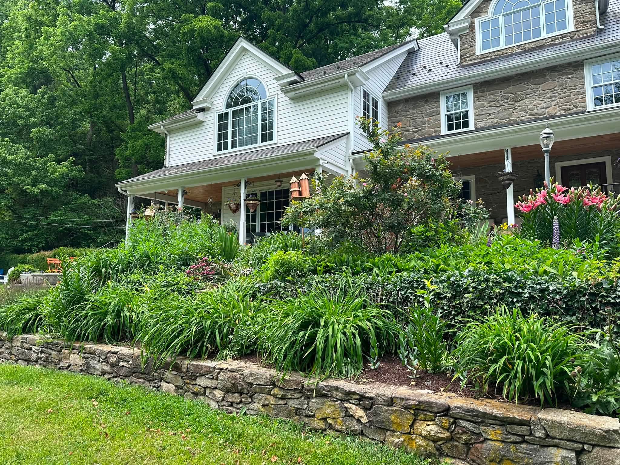 French Country Manor Estate is a historic bed breakfast with incredible gardens bridge over a river with a small waterfall feature and onsite lodging for wedding guests