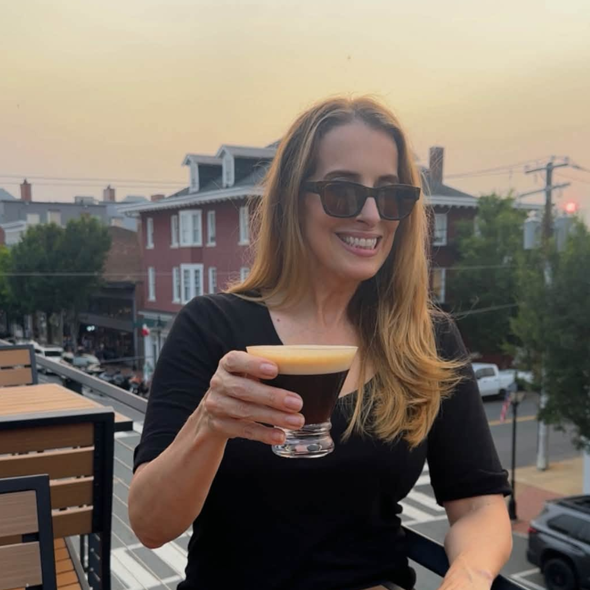 Didi Russell enjoying an espresso Martini at The Sky Bar rooftop bar over Castiglias in Fredericksburg VA during a pub crawl