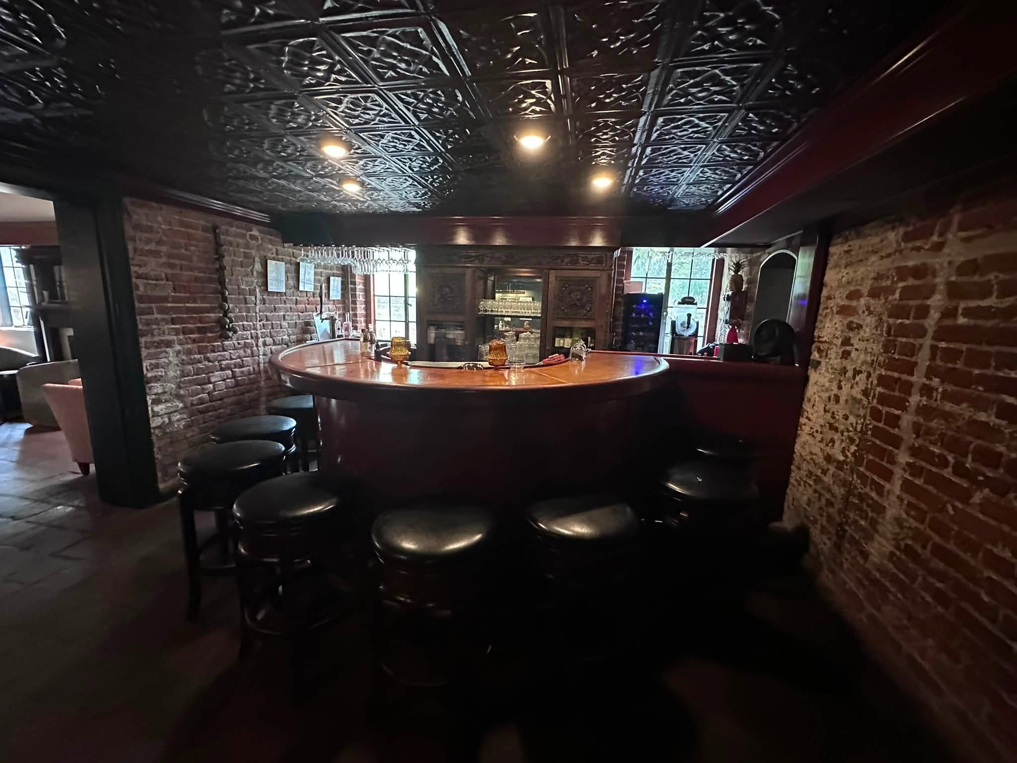 Speakeasy style bourbon bar at The Ironclad Inn FXGB VA