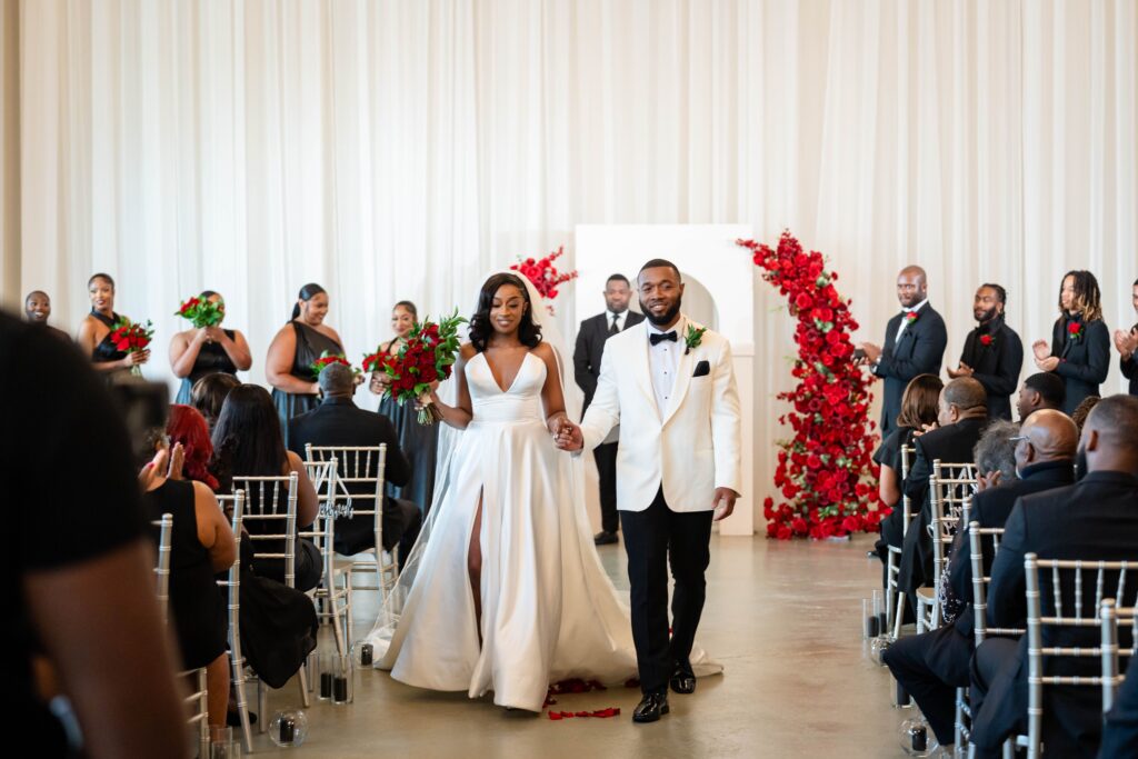 Bride & groom exit the indoor wedding ceremony at The Event at Two Ten near Winston-Salem