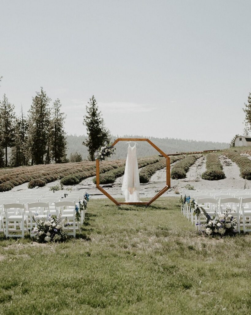 Breathtaking views of the outdoor garden wedding ceremony site with mountain views and acres of natural beauty as the backdrop for an all inclusive wedding in Spokane.