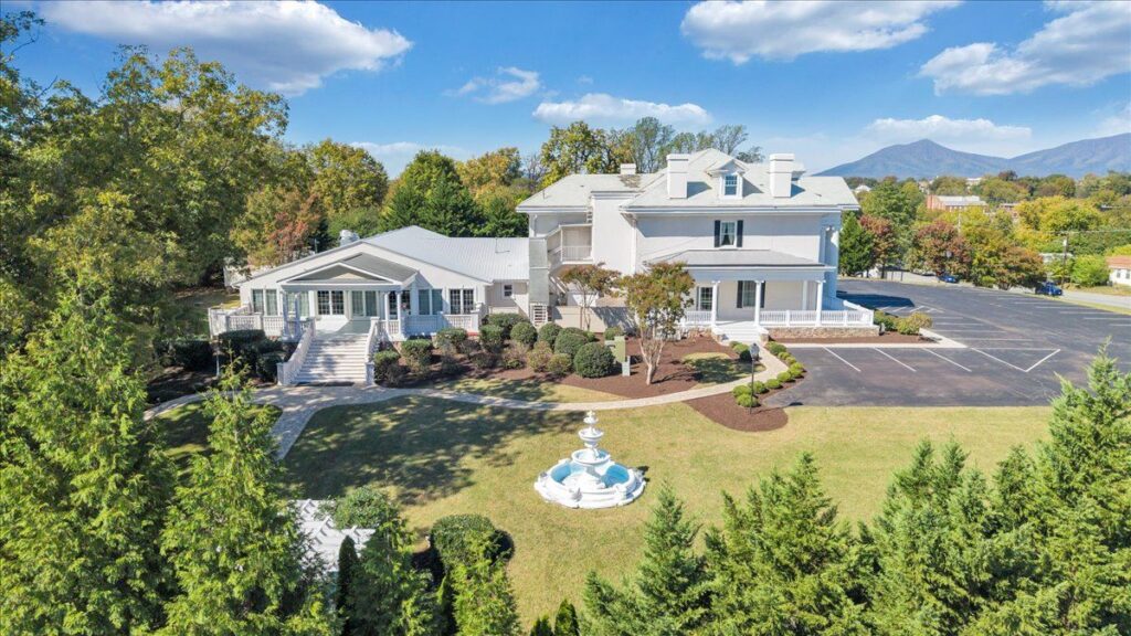 Historic wedding venue for sale in Bedford Virginia built in 1848 featuring paved parking and walkways