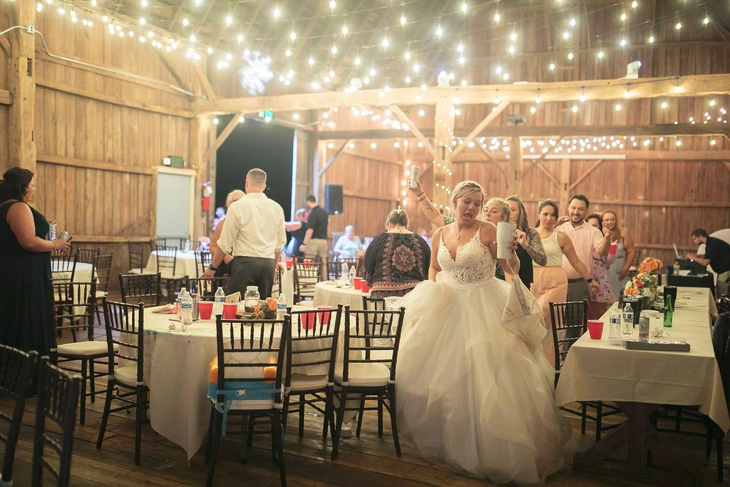 Wedding reception inside the historic Irish Hills Wedding Barn in Michigan about an hour from Ann Arbor
