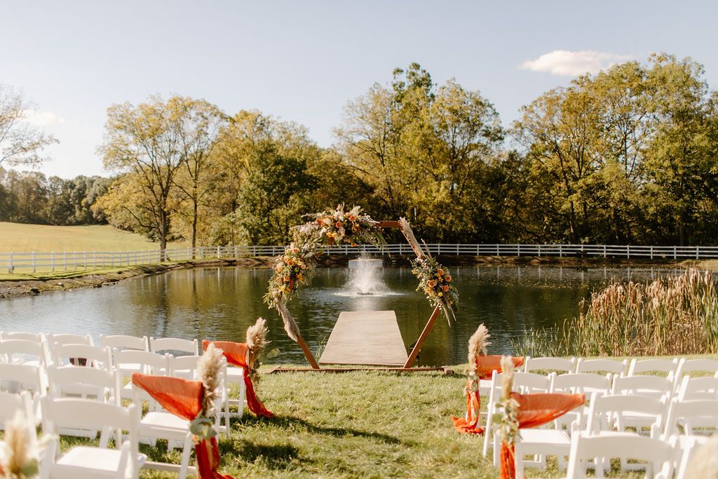 Outdoor wedding ceremony during fall at Bluestone Estate in Lancaster County,