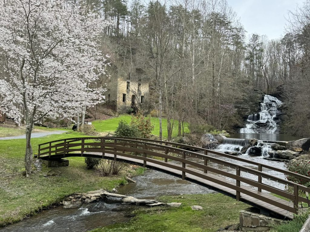 Outdoor garden wedding ceremony site at Hightower Falls in Northwest Georgia, Wooden bridge and waterfall wedding photography at Hightower Falls, Hightower Falls wedding venue in the Appalachian foothills of Georgia
