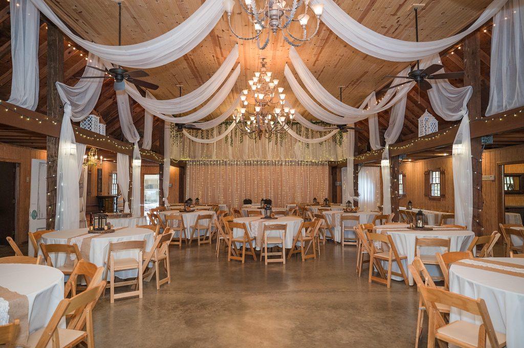 Coosa Hall indoor wedding reception with chandeliers in Cedartown GA