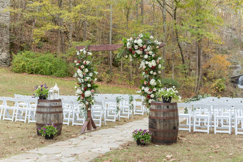 Outdoor garden wedding ceremony with 80 ft waterfall backdrop near Atlanta GA