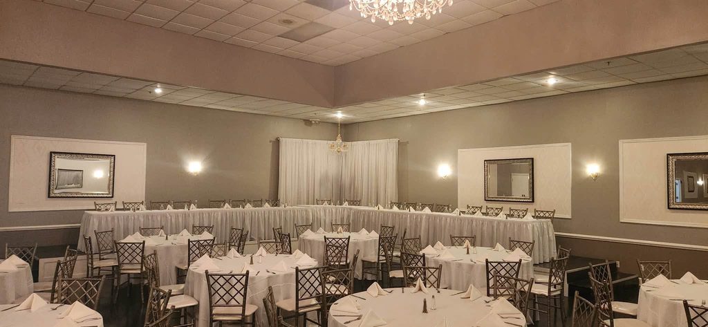 The Christy St. Louis wedding reception with decorated tables and chandeliers, Elegant banquet room at The Christy O'Fallon wedding venue, Wedding reception for 200 guests at The Christy in Missouri
