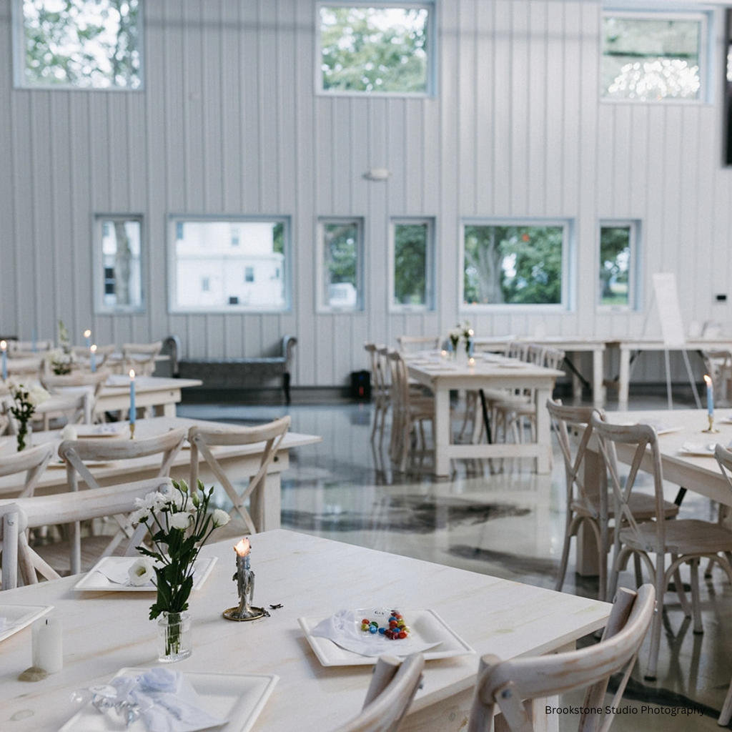 Modern indoor wedding reception in the elegant white barn setup at Pole Barn Chic in Central Illinois
